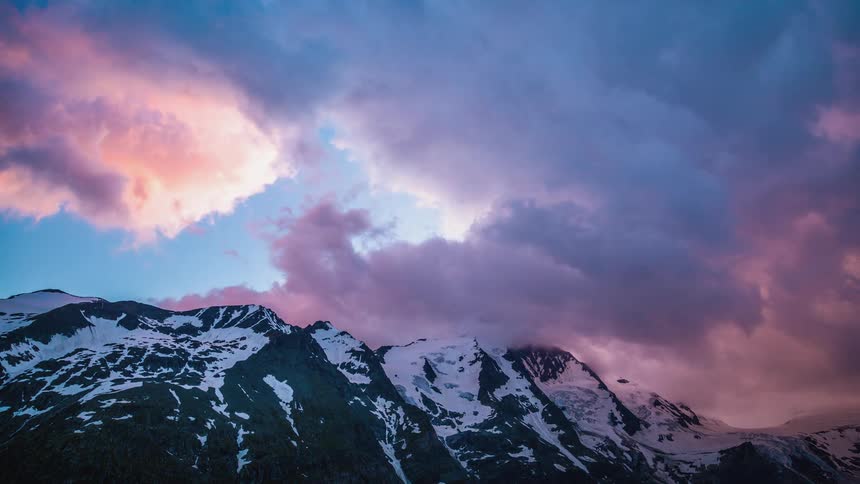 Clouds blowing over a mountain top