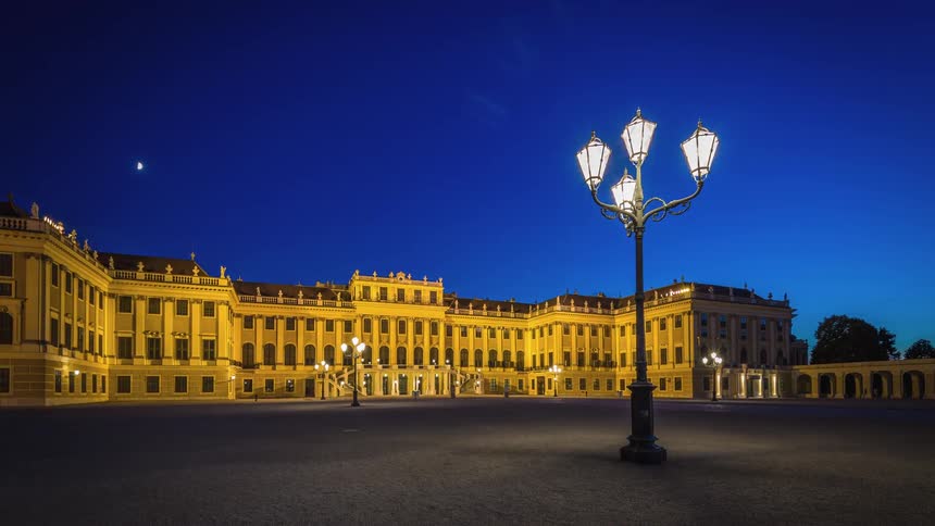 Night falls on a large building