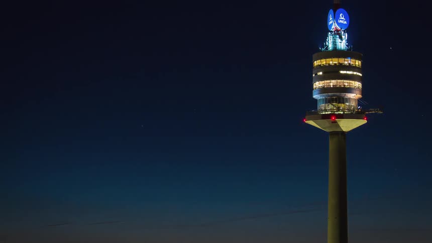 A tower like building during the evening and night