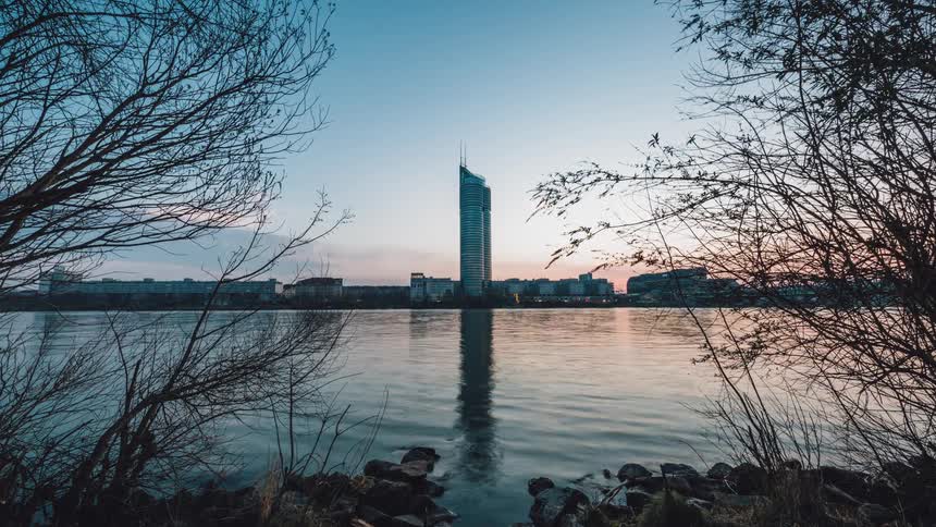 A river runs by a coastal city