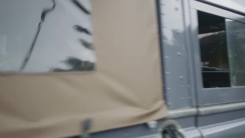 A man with a weapon gets into a truck which then drives off