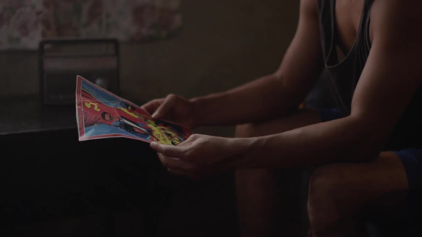 A man studying a poster