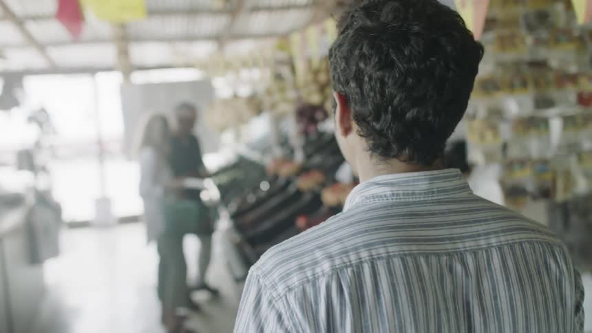 A man walks through a grocery isle