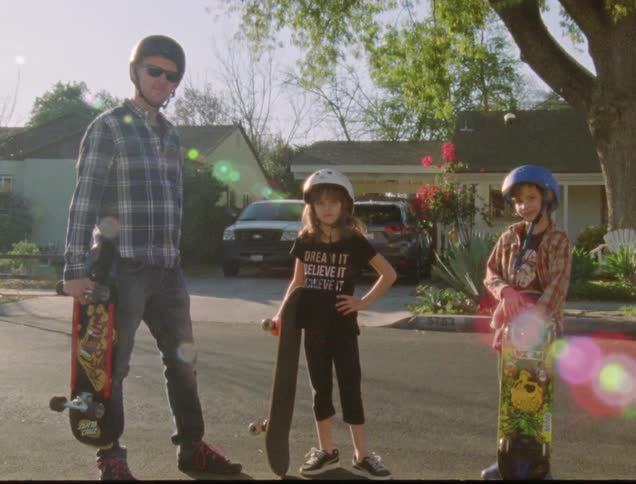 People posing with skateboards