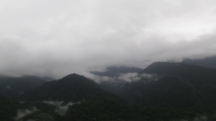 Clouds shroud a mountain range