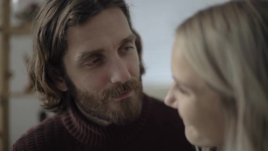 Man and woman smile at each other
