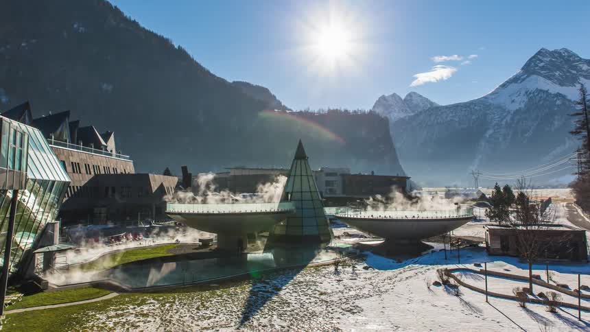 A town with mountains and the sky in the background