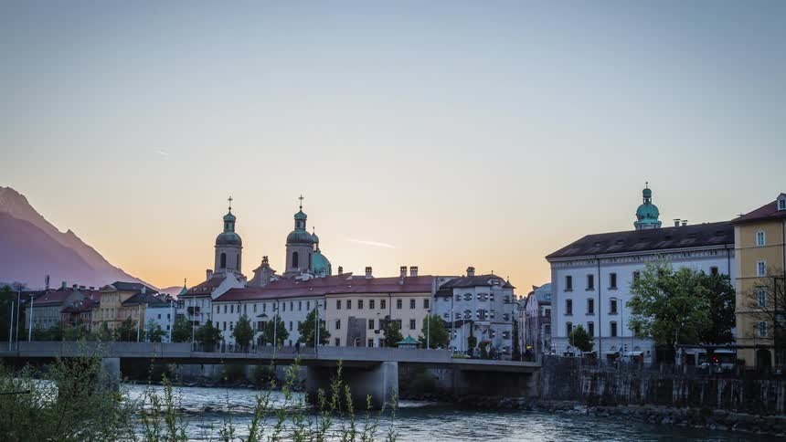 A picturesque mountainside town along a river
