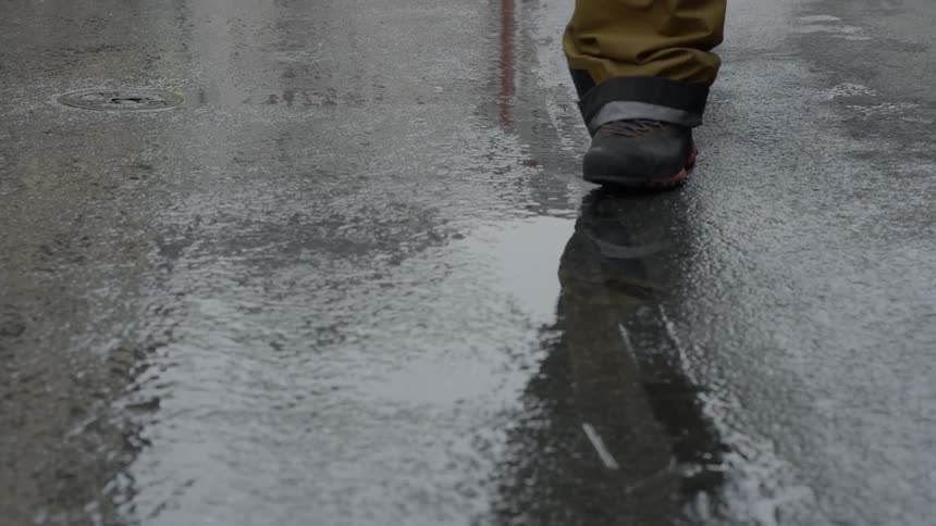 Man walking under the rain