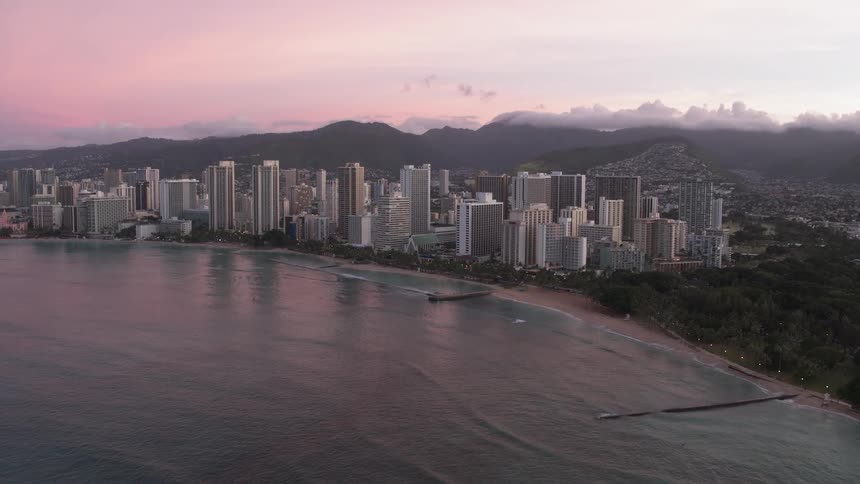High rise buildings fill the shoreline next to the ocean
