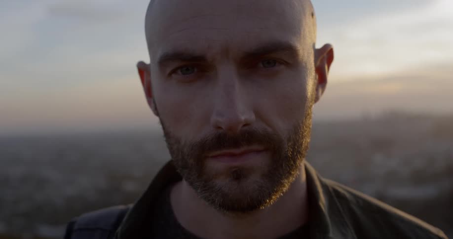 A man stares at the camera