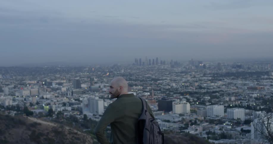 A man looking out into the city skyline