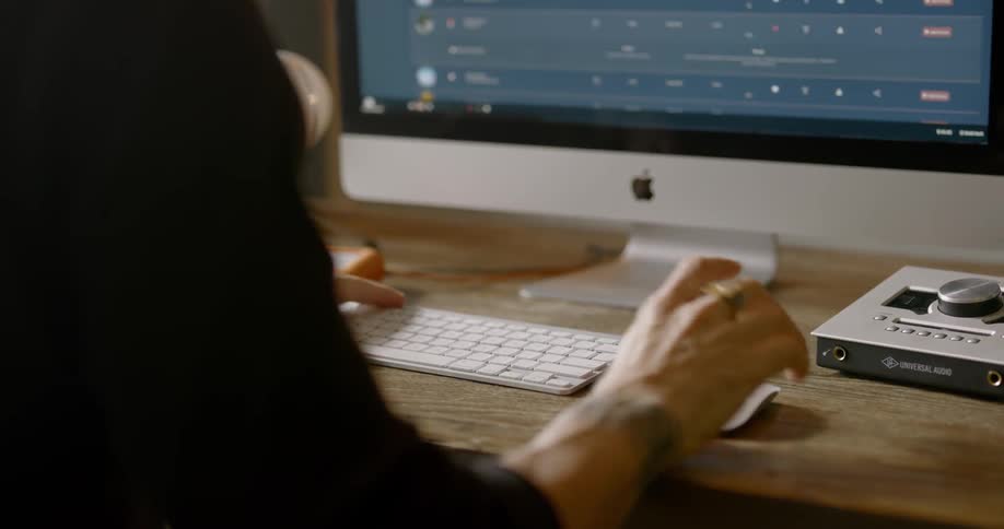 Man on desktop using mouse and keyboard on computer