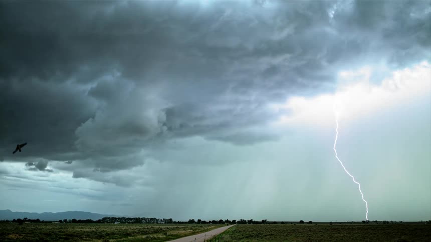 A lightning storm rages over a rural area