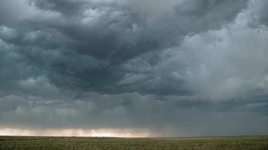 Thunderstorm over grass plains