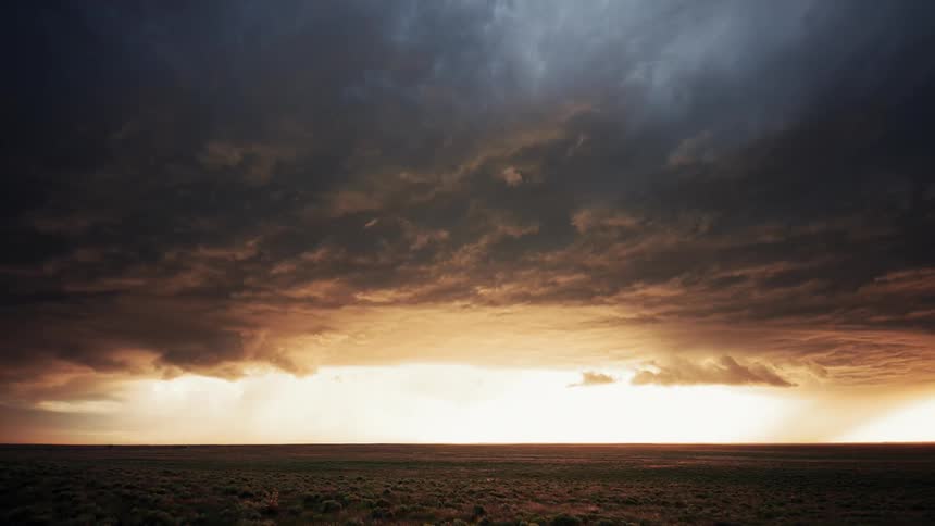 Storm clouds moving over a plain
