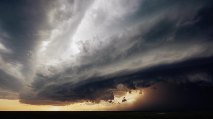 Clouds run across the dark sky