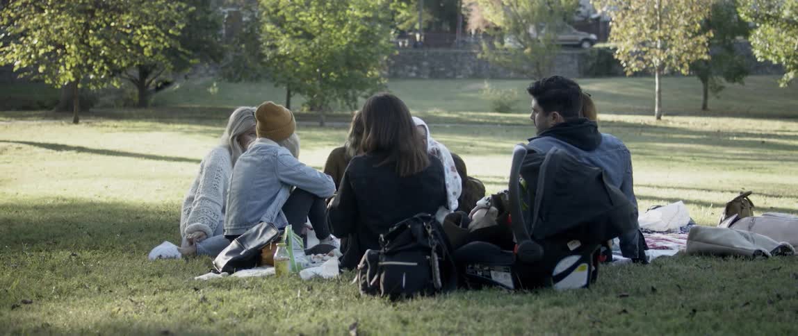A group of friends have a picnic in the park