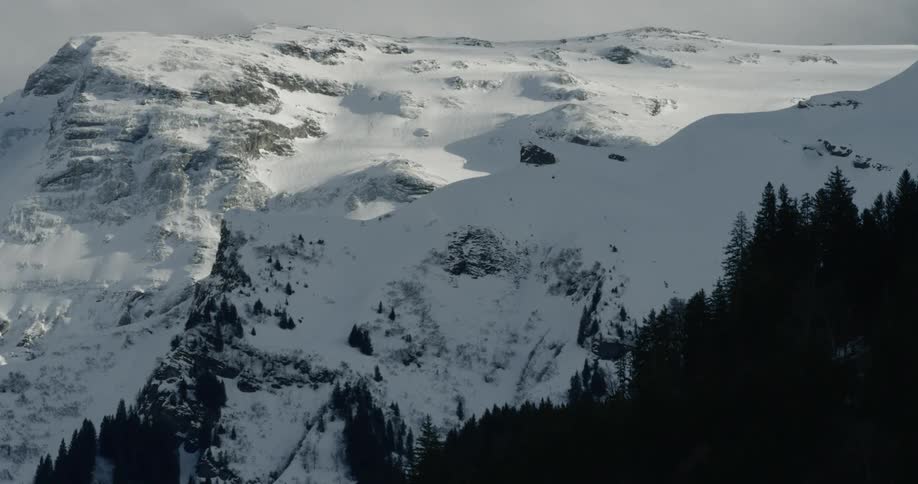 Landscape of the snowcapped mountain with sun shining on its top during daylight