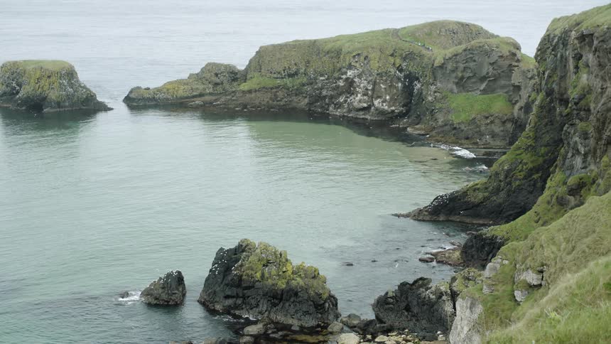 Large mountain side masses on the coast line
