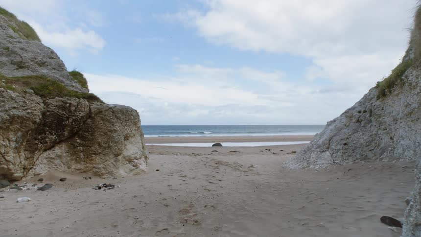 The ocean between a few rock formations