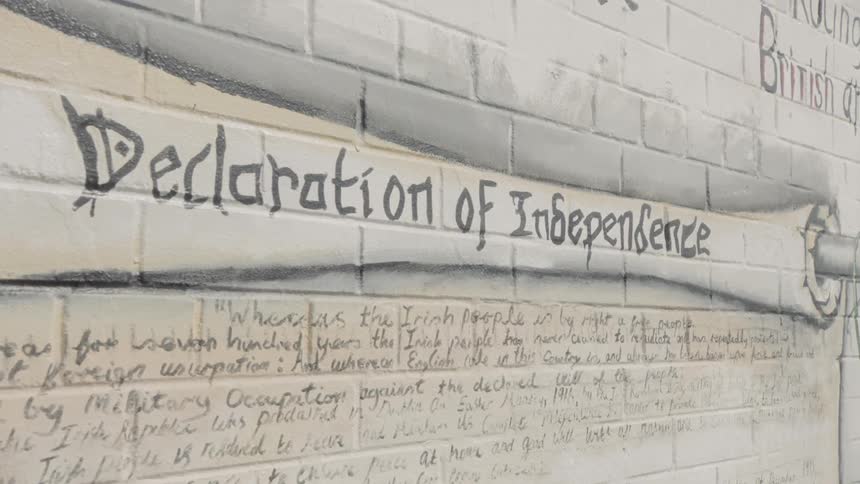 A wall mural painted on a brick wall