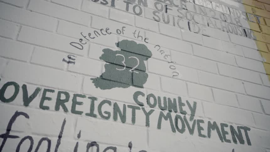 An irish mural painted on a brick wall