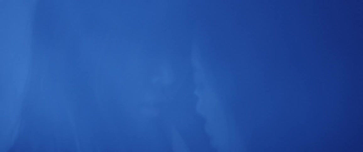 Two people embrace one another