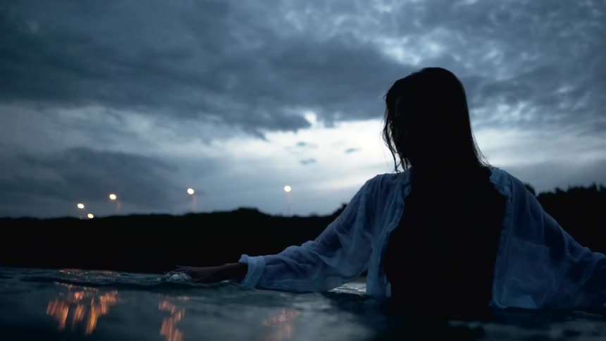 A woman standing in water