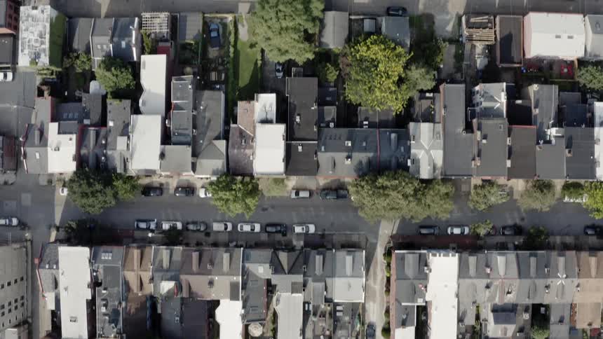 Tree lined streets full of houses and structures