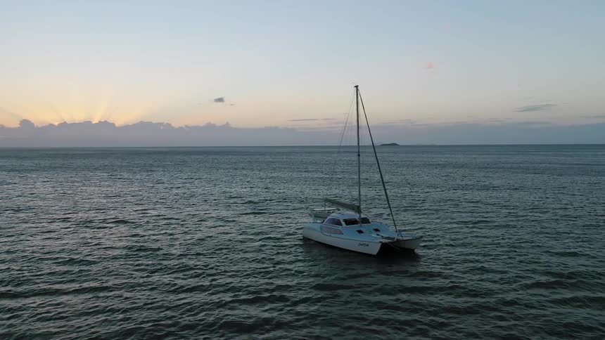 A boat floats on the ocean