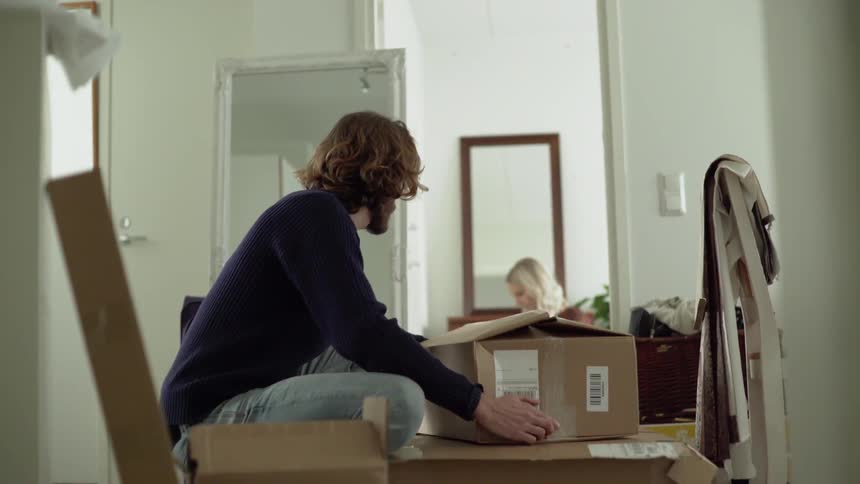 A man setting down a box