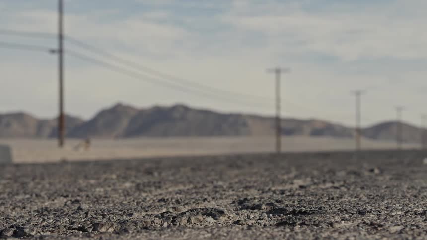 A rough road running through a desert area