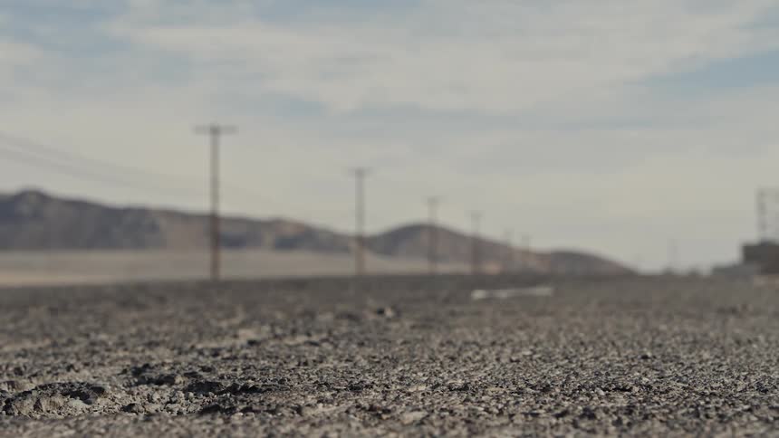 A rough road running through a rural area
