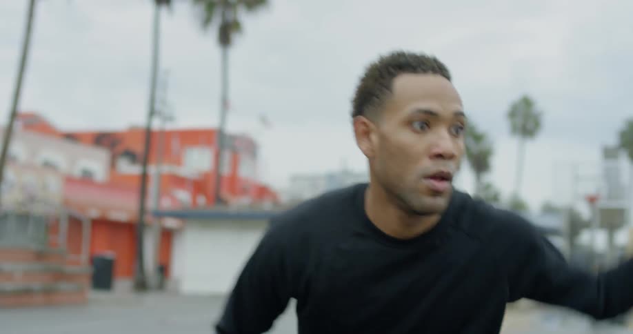 A man dribbles a basketball