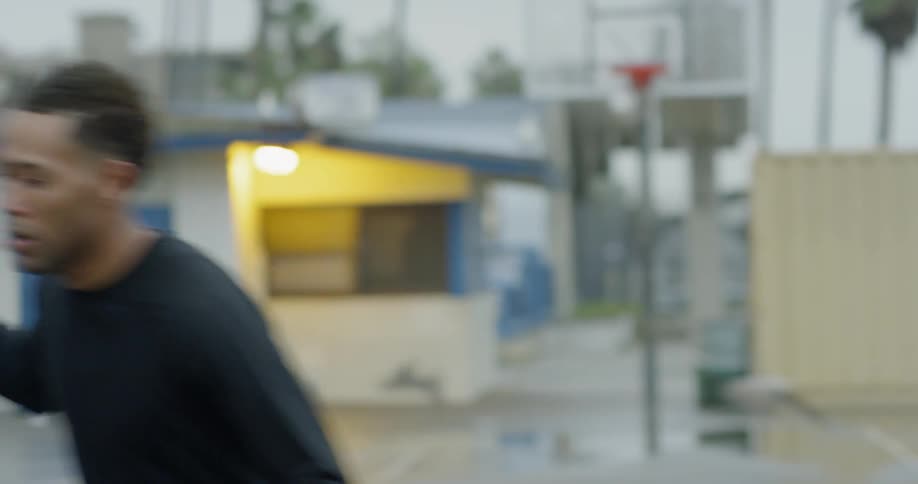 A man bouncing a basketball