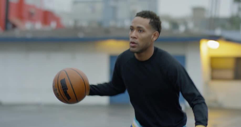 A man bouncing a basketball