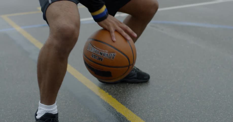 Man dribbles ball with front and back hand
