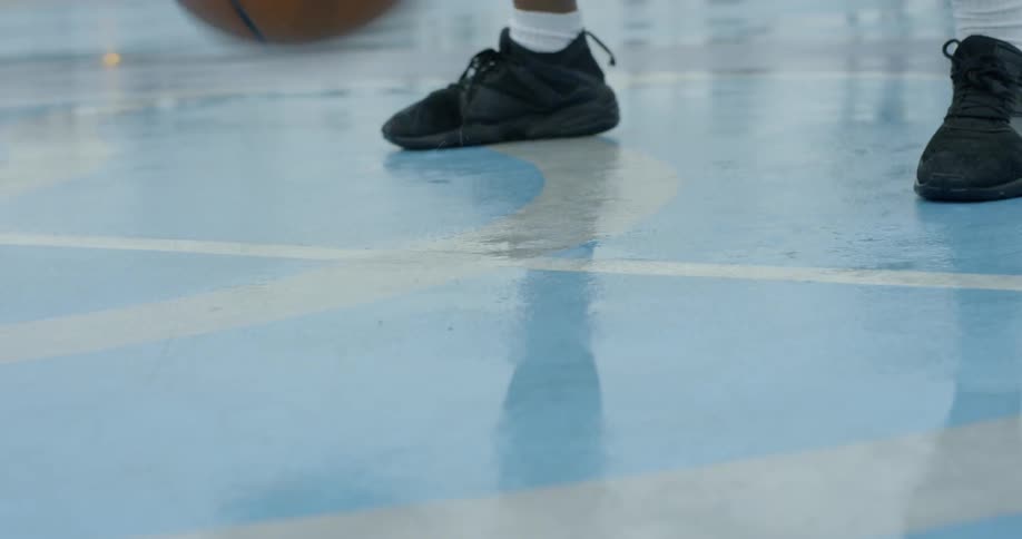 A man bouncing a basketball