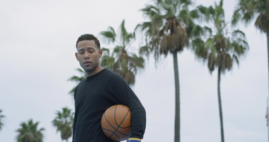 A man holding a basketball