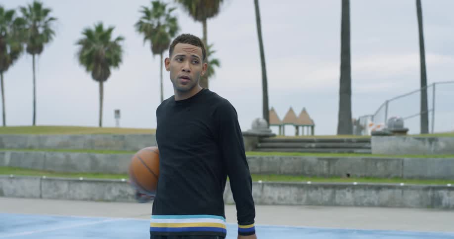 A man holding a basketball