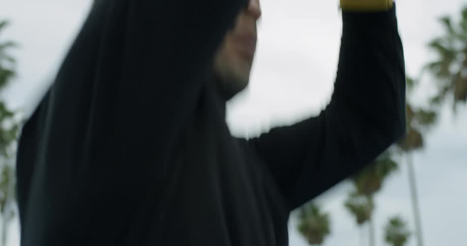 Man shoots basketball
