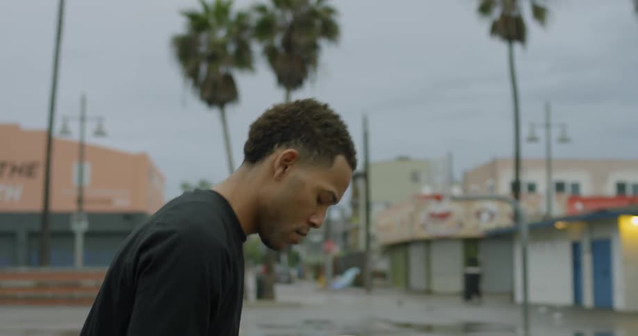 Man dribbles then takes shots with basketball