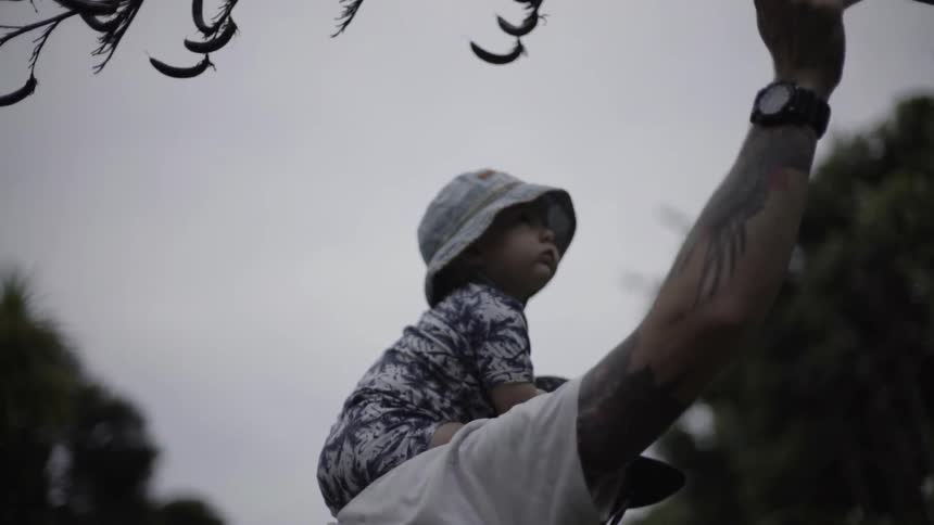 Parent Gently Holding a Young Child Close While Walking, Expressing Trust and Comfort.