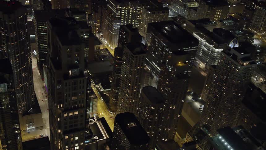 A city at night with skyscrapers buildings and roads