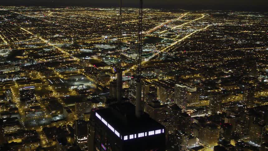 An aerial view of a downtown city at night