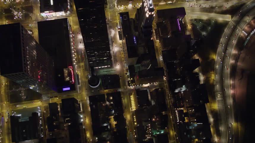 A city block of a metropolis from above at night