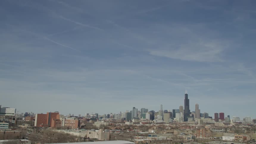 An aerial view of a downtown city is displayed
