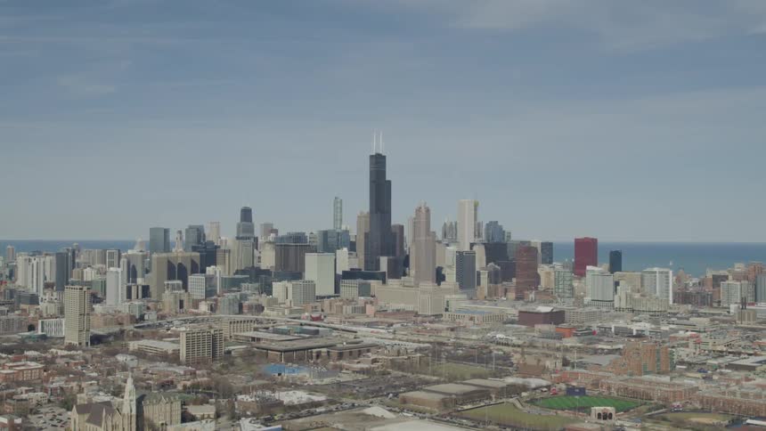 Skyline of the city with tall buildings next to the ocean during daylight