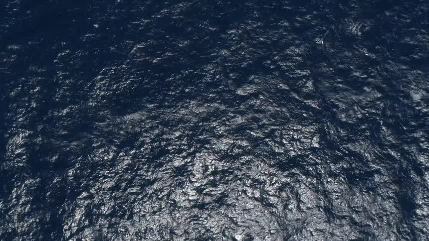 Light reflects off of ocean waves